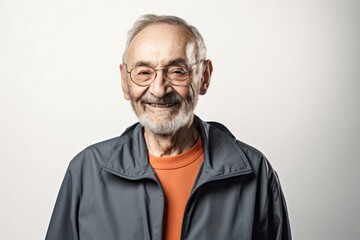 Wall Mural - Environmental portrait photography of a satisfied man in his 70s wearing a comfortable tracksuit against a white background. Generative AI