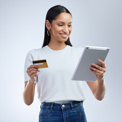 Poster - Therere more ways than one to make your money grow. a woman holding a bank card and using a digital tablet against a grey background.