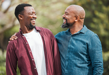 Canvas Print - Like father like son. a father and son spending time together outside.