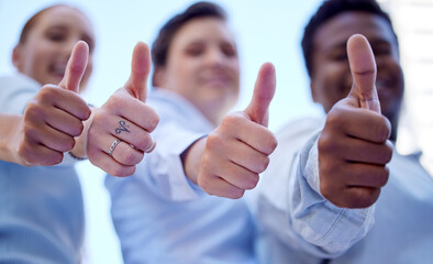 Poster - Well back that three times over. Low angle shot of three unrecognizable businesspeople giving thumbs up to the camera while standing outside.