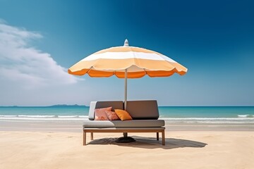 Sofa and umbrella on sand beach with sea and sky background. summer vacation concept