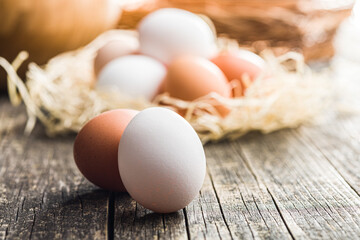 Sticker - Whole chicken eggs on wooden table.