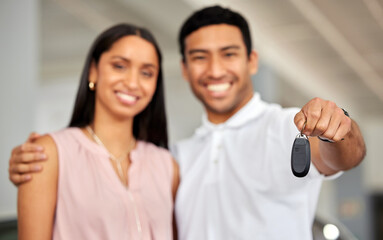 Wall Mural - We just bought a new car. a young couple showing their car keys.