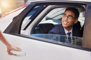 Poster - You have arrived at your destination. a handsome young businessman sitting in the backseat of a taxi.