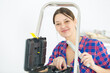 © auremar - attractive workwoman with toolbox near ladde