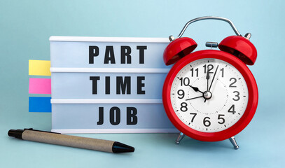 Poster - text part-time job written on the lightbox with alarm clock and colorfull stickers on blue backgroun