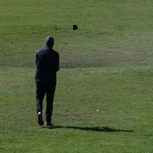 Golfer Lining Up His Stroke