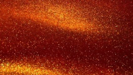 Wall Mural - Overflowing and dispersion of gold particles jets in red liquid. Gold dust particles floating and flying apart in red fluid. Beautiful golden glitters shiny moving background.