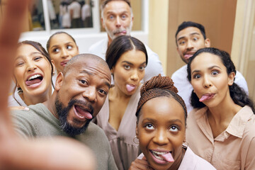 Wall Mural - Office fun with business friends. a group of colleagues taking a selfie in a office.