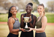 © Nina Lawrenson/peopleimages.com - Its all about lifting the trophy. Cropped portrait of three attractive young female athletes celebrating their victory.