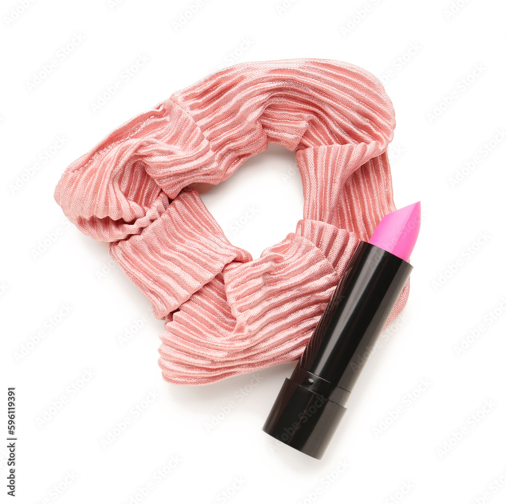 Stylish scrunchy and lipstick on white background