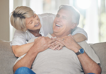 Poster - Being a family means you are a part of something very wonderful. a mature couple sitting on the couch at home.