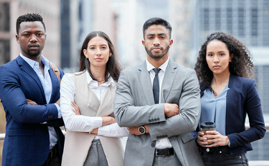 Poster - Nothing will stop us from reaching even greater heights. Portrait of a group of confident businesspeople standing with their arms crossed in the city.