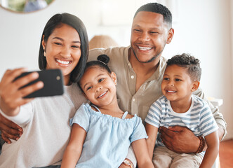 Sticker - Frozen to be cherished. a young family taking a selfie while bonding together on a sofa.