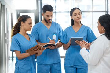 Aufkleber - Coming together as the top in their field. a group of medical practitioners having a discussion in a hospital.