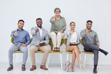 Leinwandbilder - Thumbs up for all the good work. Cropped studio shot of a group of businesspeople in line against a white background.