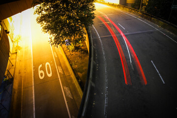 Highway at night with speed limit written on the road