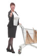 Full length portrait of a woman pushing a shopping trolley