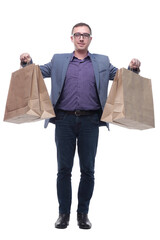 Wall Mural - Good looking young man holding shoping bags