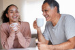 © Talia M/peopleimages.com - Whats been happening in your life. a woman having some tea with her father.