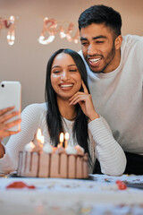 Poster - Capturing the special occasion. a young couple using a cellphone while celebrating a birthday at home.