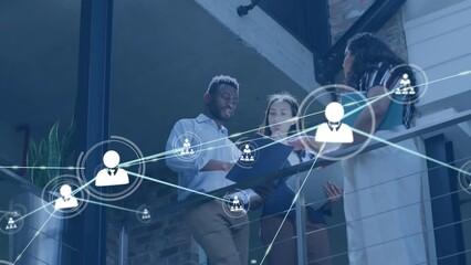 Wall Mural - Animation of network of connections with icons over diverse business people in office