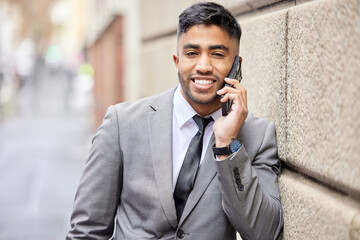 Canvas Print - Give me the news. a handsome young businessman traveling through the city on his morning commute into work.