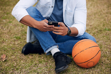 Poster - Basketball and beats are all you really need. an unrecognisable man using a smartphone outside at college.