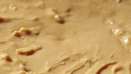Poster - peanut butter close-up rotates in a circle
