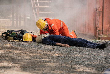 Wall Mural - The firefighters carefully approached the victims lying on the floor checking for any signs of danger, Saving people.