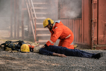 Wall Mural - The firefighters applied their training and experience to perform life saving measures on the unconscious victim, Saving people.