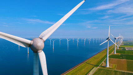  windmill park with a blue sky on a sunny day in the Netherlands, biggest windmill park in the ocean