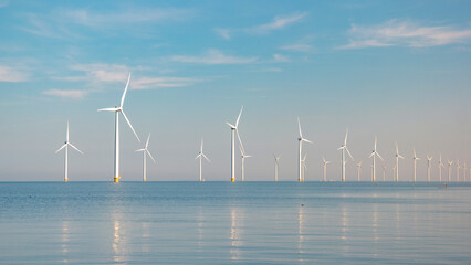  windmill park with a blue sky on a sunny day in the Netherlands, biggest windmill park in the ocean