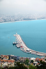 Wall Mural - Aerial view of Alanya marina and city on a cloudy day