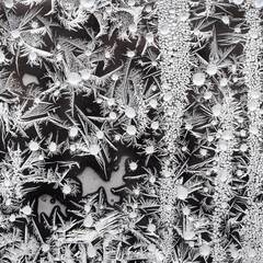  frostwork on window glass closeup on cold winter day