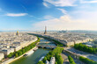 Paris aerial panorama with river Seine and Eiffel tower, France. Romantic summer holidays vacation destination. Panoramic view above historical Parisian buildings and landmarks with blue sky and sun