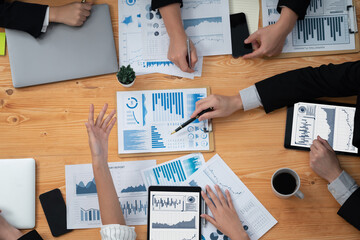 Poster - Top-view closeup business team of financial data analysis meeting with business intelligence, report paper and dashboard on laptop. Business group people working together in harmony office.