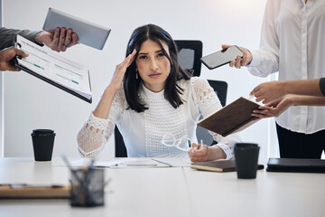 Poster - When can I leave. Shot of a young businesswoman looking stressed out in a demanding work environment.