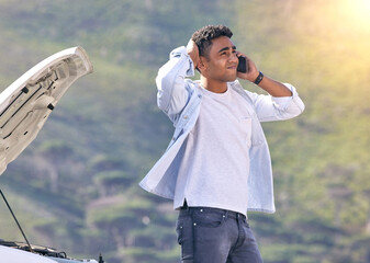 Poster - When can you guys get here. Cropped shot of a handsome young man on the phone with roadside assistance after suffering a vehicle breakdown.