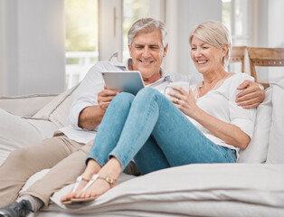 Poster - Your smile makes me smile. Shot of a elderly couple using a tablet at home.