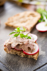 Wall Mural - sandwich with baked meat, radish and herbs