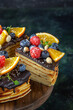 front view yummy chocolate cake with fruits on dark background biscuit dough sugar cake pie sweet