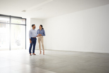 Poster - Welcome Home Its the perfect place for you. Shot of a young male real estate agent showing a client a house.