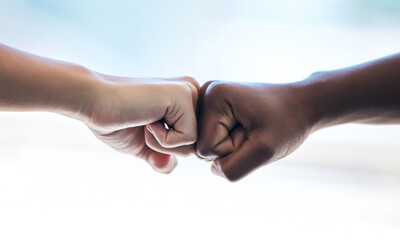 Poster - Business cant be stopped. Cropped shot of two unrecognizable businesswomen fist bumping while standing in an office.