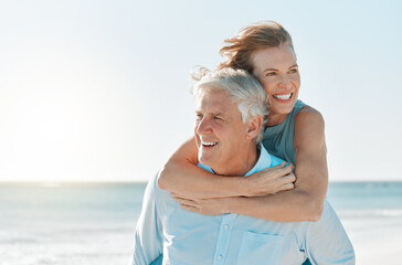 Poster - Were having a lovely day at the beach. Shot of a mature couple spending time together at the beach.