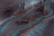 © ADDICTIVE STOCK - Oil slicks on wet asphalt
