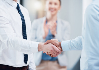 Poster - The start of a great partnership. Shot of two unrecognizable businesspeople shaking hands in an office at work.