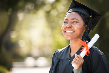 Wall Mural - This feels like a miracle come true. Shot of a young woman holding her diploma on graduation day.