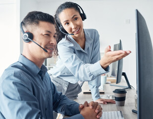 Poster - Using the right methods and tools to accurately assist customers. Shot of two call centre agents working together on a computer in an office.