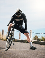 Looking for motivation. Full length shot of a handsome mature man taking a break while cycling outdoors.